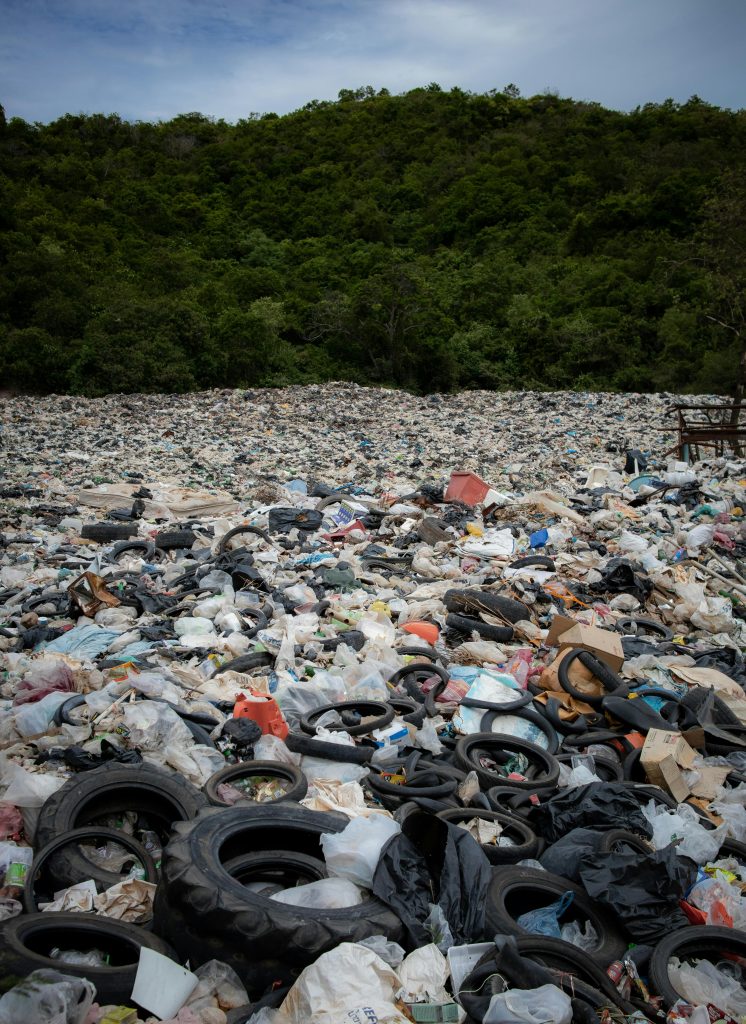 pexels-photo-2768961-2768961 Expansive view of a landfill filled with tires and rubbish in Pattaya, Thailand.